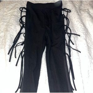 Black slack type pants with fringe,
reminiscent of 90s & Y2K style